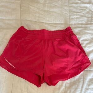 Bright pink lululemon hotty hot shorts
